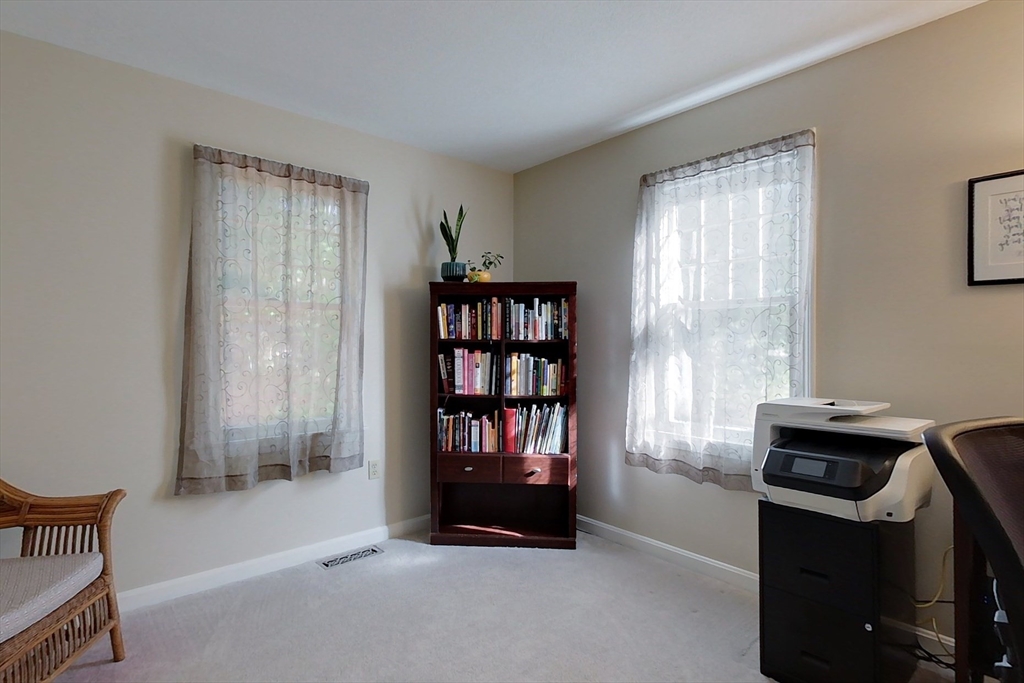8 Tucker Park, Unit D Pepperell, MA 01463 - Photo 15 of 35 a living room with furniture and a window