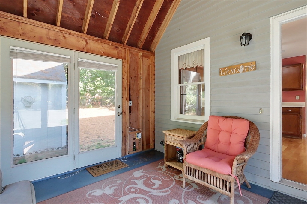 8 Tucker Park, Unit D Pepperell, MA 01463 - Photo 18 of 35 a living room with furniture a rug and a window