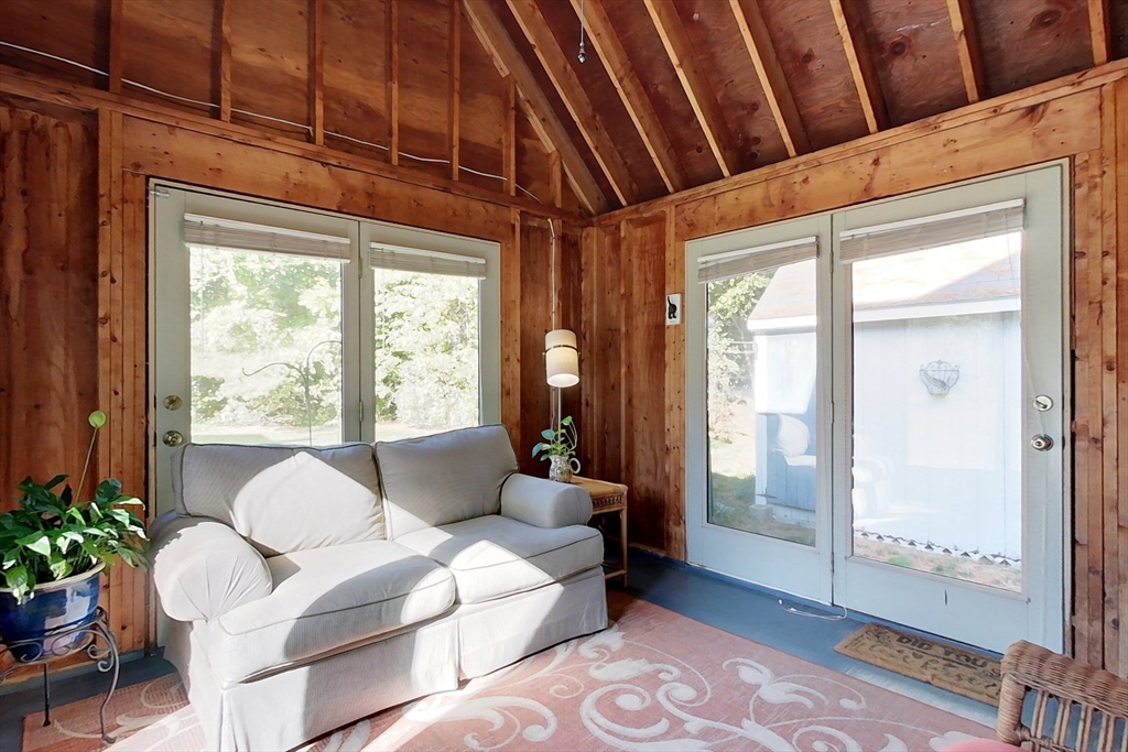 8 Tucker Park, Unit D Pepperell, MA 01463 - Photo 19 of 35 a living room with furniture and a large window