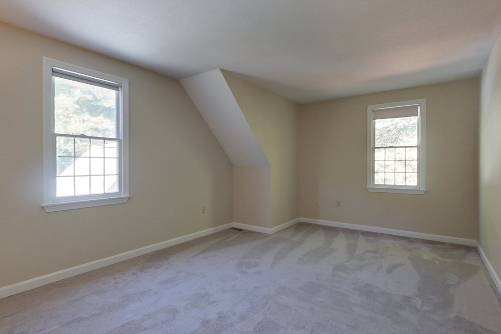 8 Tucker Park, Unit D Pepperell, MA 01463 - Photo 23 of 35 an empty room with a window