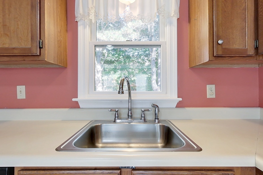 8 Tucker Park, Unit D Pepperell, MA 01463 - Photo 3 of 35 a kitchen with a sink and a window