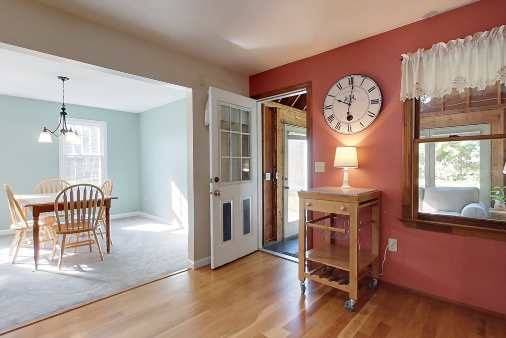 8 Tucker Park, Unit D Pepperell, MA 01463 - Photo 6 of 35 a view of a room with a table and chairs