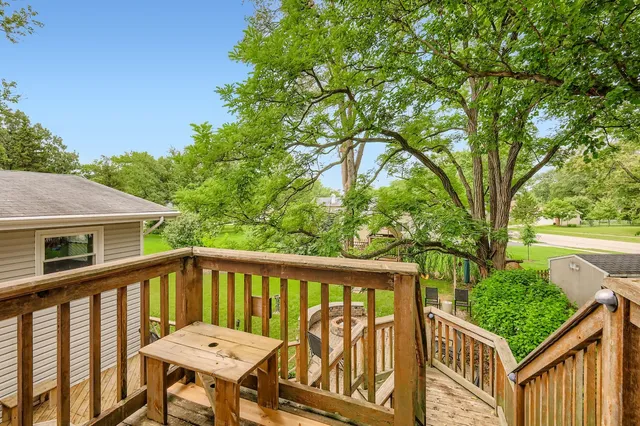 a view of a wooden fence and a yard