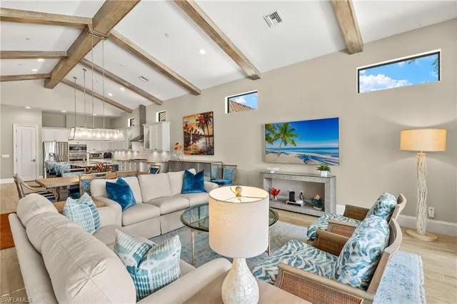 a living room with fireplace furniture and a flat screen tv