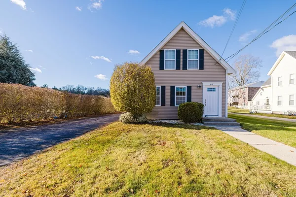 a view of a house with a yard