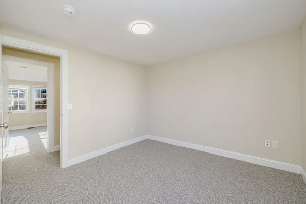 an empty room with a empty space and windows