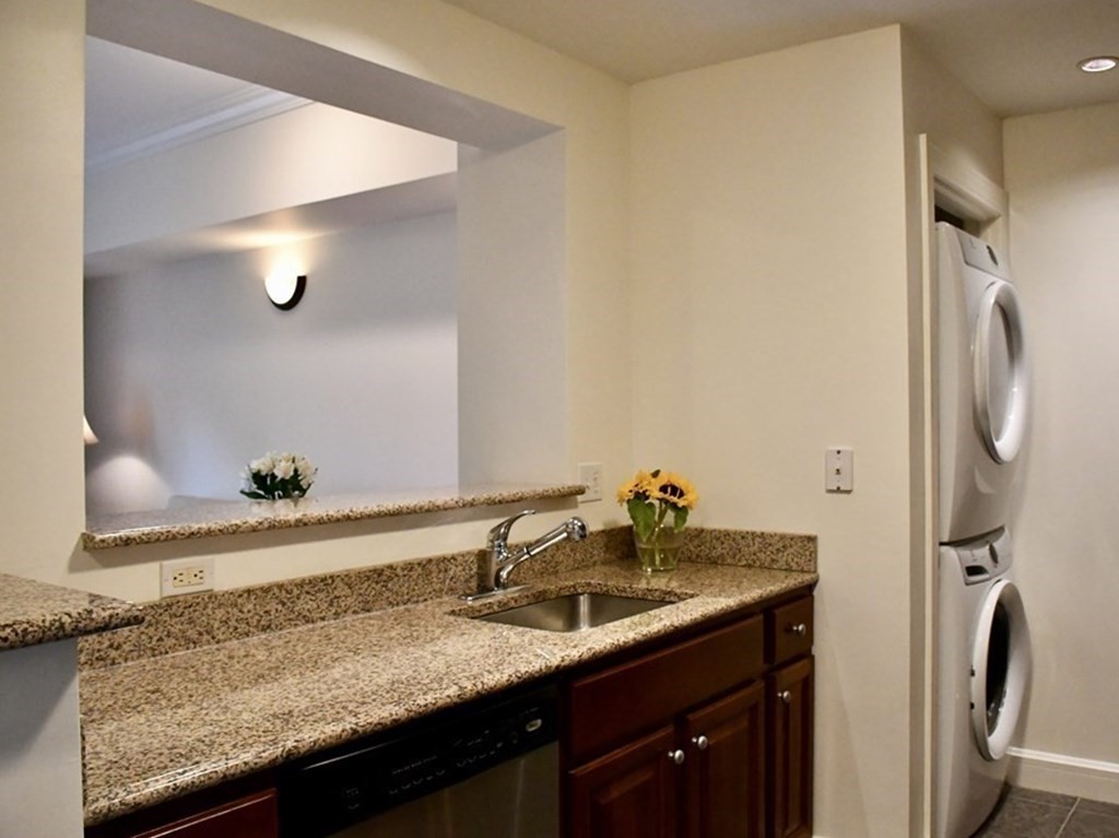 36 Village Road, Unit 713 Middleton, MA 01949 - Photo 11 of 39 a bathroom with a granite countertop sink and a mirror