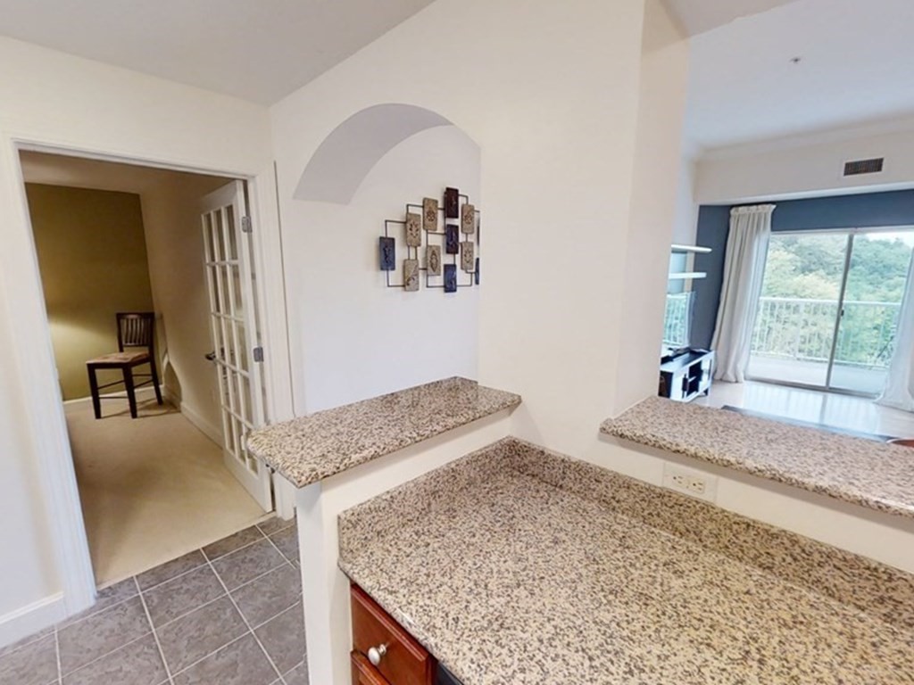 36 Village Road, Unit 713 Middleton, MA 01949 - Photo 12 of 39 a bedroom with a sink and a mirror