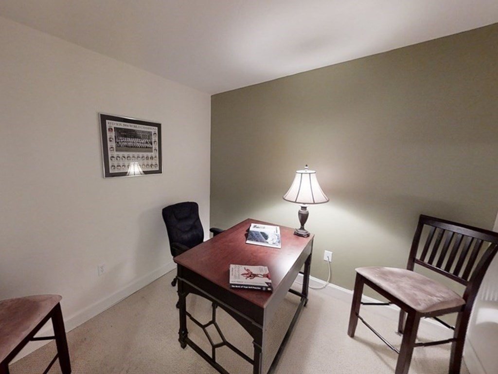 36 Village Road, Unit 713 Middleton, MA 01949 - Photo 13 of 39 a living room with furniture and a lamp
