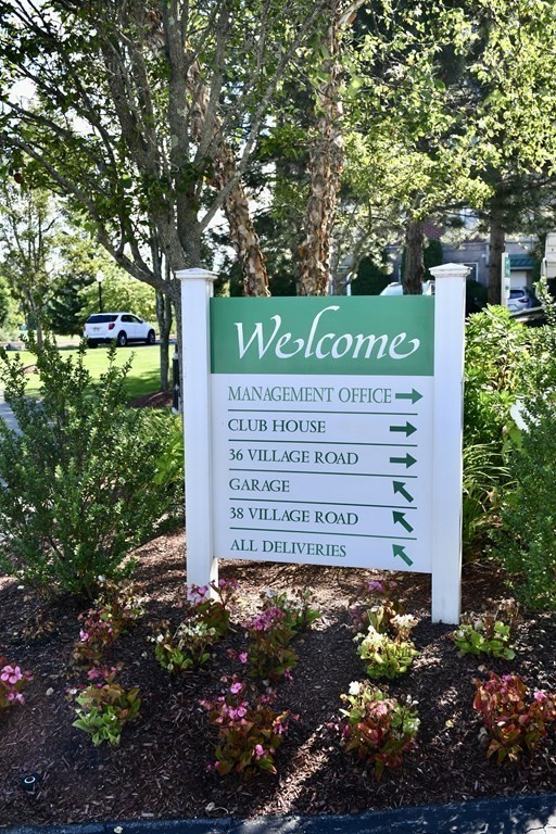 36 Village Road, Unit 713 Middleton, MA 01949 - Photo 22 of 39 a view of a sign board with plants