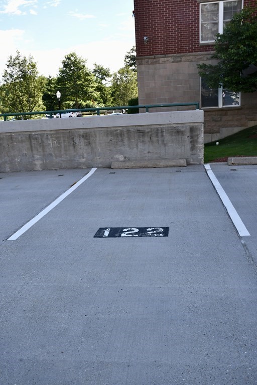 36 Village Road, Unit 713 Middleton, MA 01949 - Photo 30 of 39 front view of a house with a yard