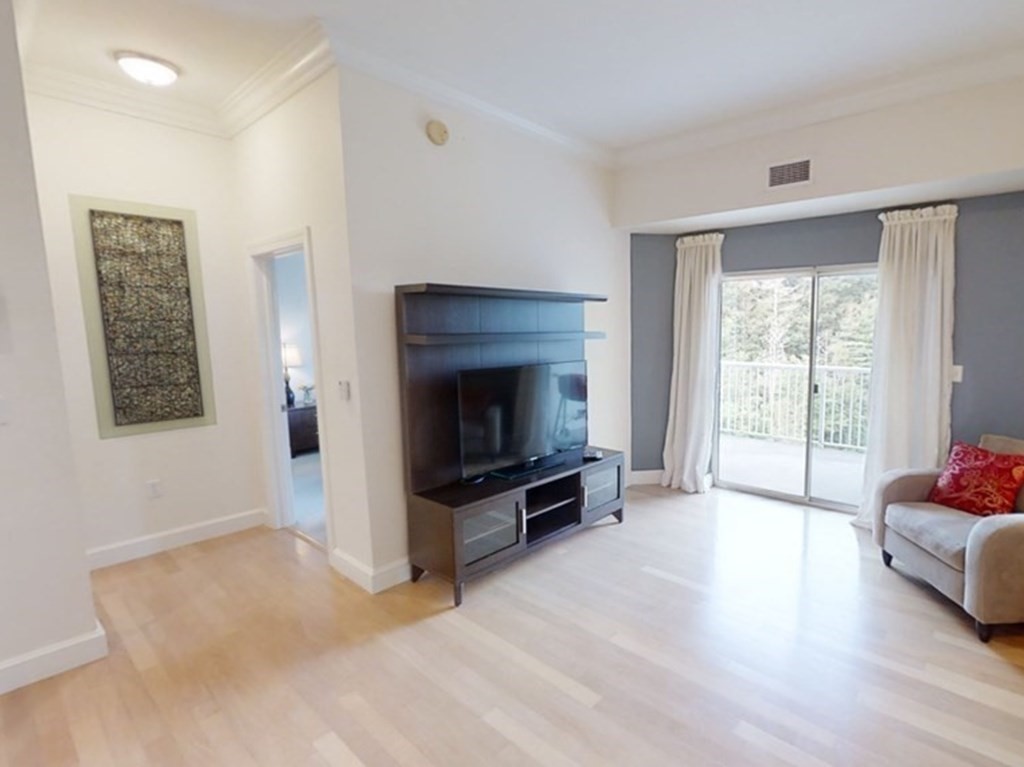 36 Village Road, Unit 713 Middleton, MA 01949 - Photo 3 of 39 a living room with furniture and a fireplace