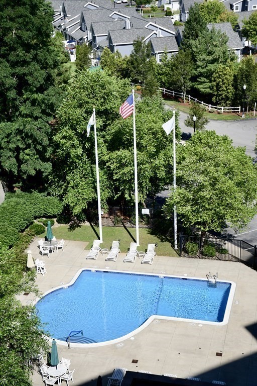 36 Village Road, Unit 713 Middleton, MA 01949 - Photo 33 of 39 a view of a chairs and table in the patio