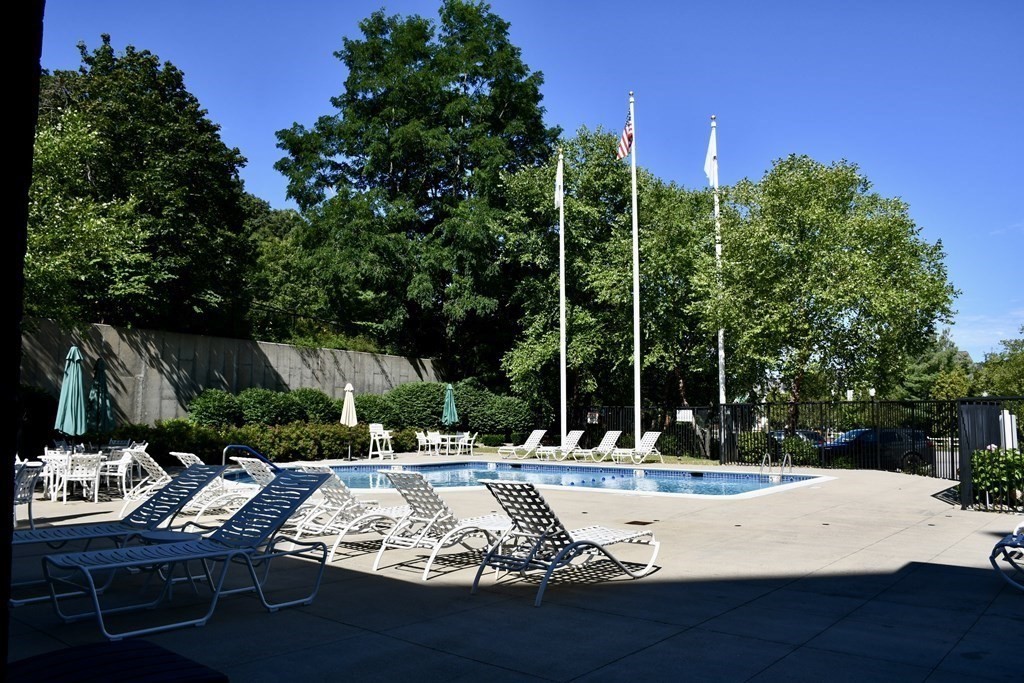 36 Village Road, Unit 713 Middleton, MA 01949 - Photo 34 of 39 a view of a fountain is middle in the garden