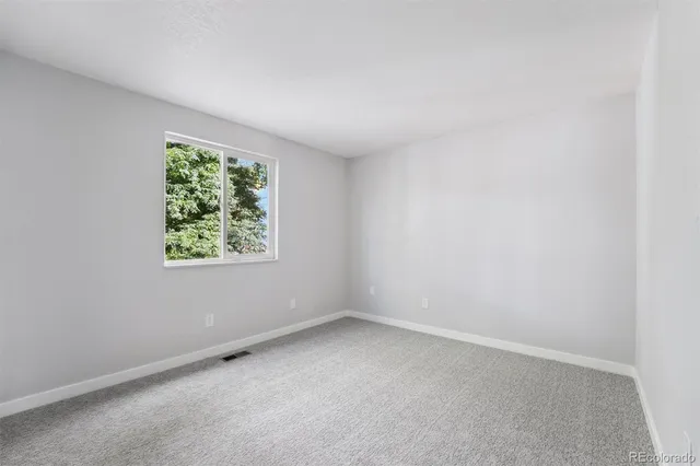 a bathroom with a sink toilet vanity and shower