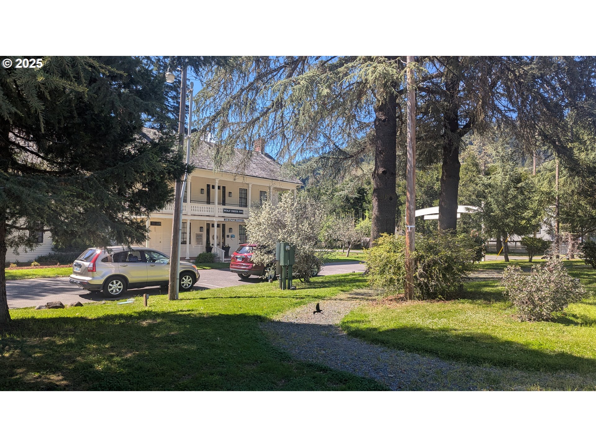 2999 Speaker Road Wolf Creek, OR 97497 - Photo 16 of 29 a view of an house with backyard swimming pool and outdoor seating
