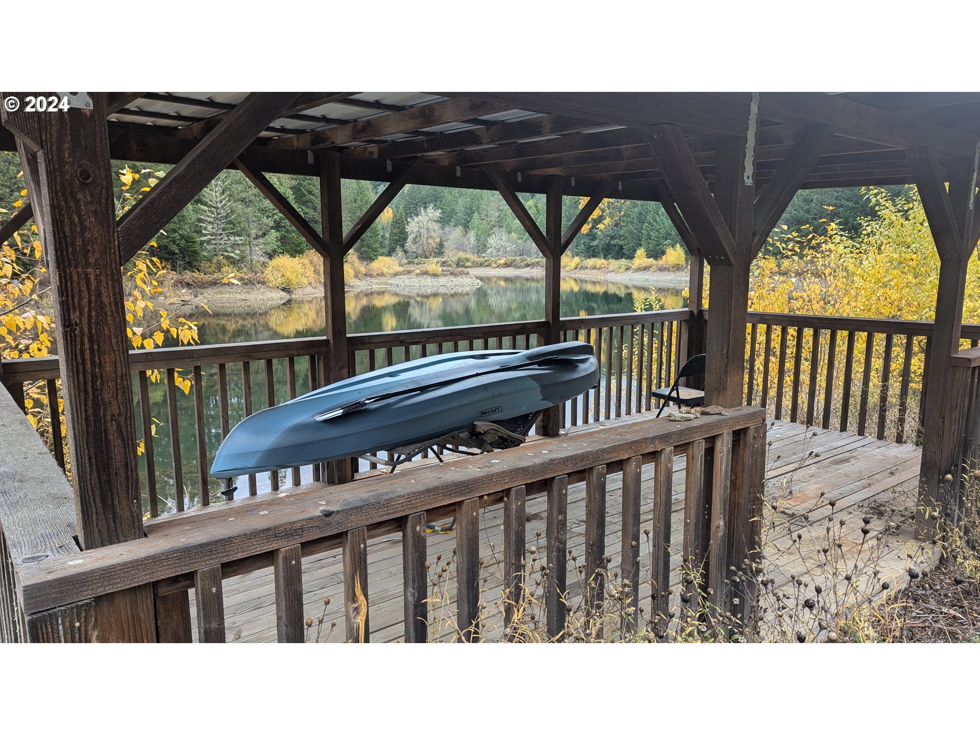 2999 Speaker Road Wolf Creek, OR 97497 - Photo 4 of 29 a view of a roof deck with wooden fence