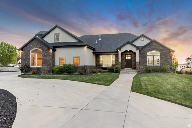1526 South 500 West Mapleton, UT 84664 - Photo 2 of 54 Craftsman house featuring stone siding, stucco siding, a porch, a front yard, and roof with shingles