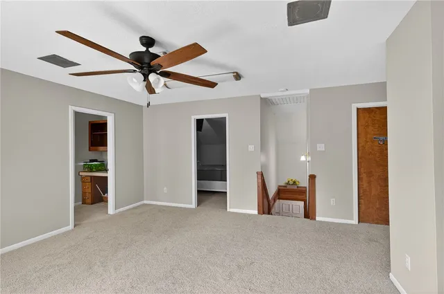 a view of a livingroom with a ceiling fan