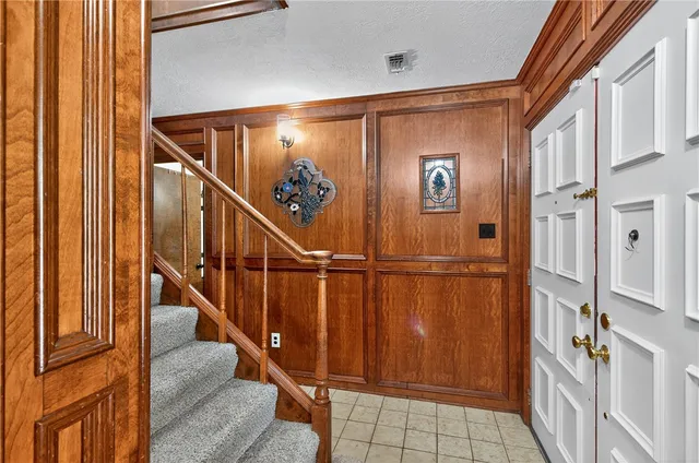 a view of an entryway with wooden floor