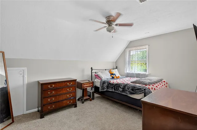 a bed room with a bed and a window