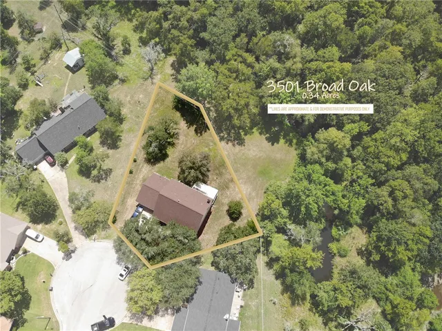 an aerial view of a house with yard swimming pool and outdoor seating