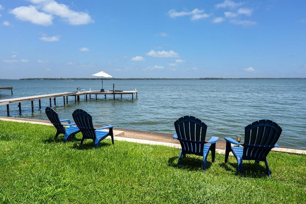 a view of a chairs in backyard of kitchen
