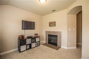 1409 Rosson Road Little Elm, TX 75068 - Photo 12 of 34 Recessed fireplace with a tile surround and hearth