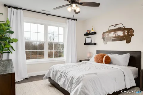 a bedroom with a bed and window