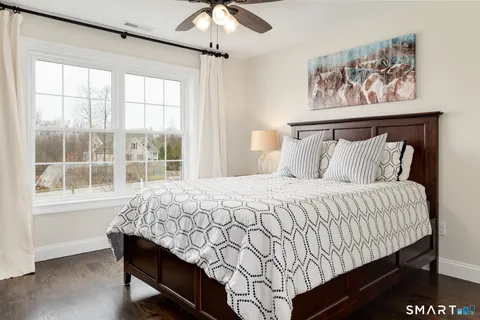 a bedroom with a bed and window