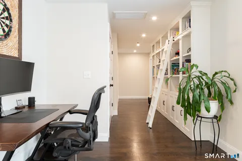 a workspace with furniture and wooden floor
