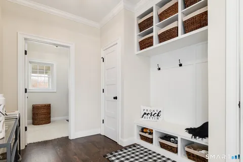 a view of an entryway with wooden floor