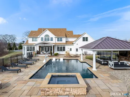 a view of multiple houses with a swimming pool