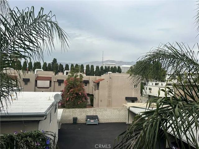 a terrace with outdoor seating and city view