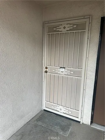 a view of door with wooden floor