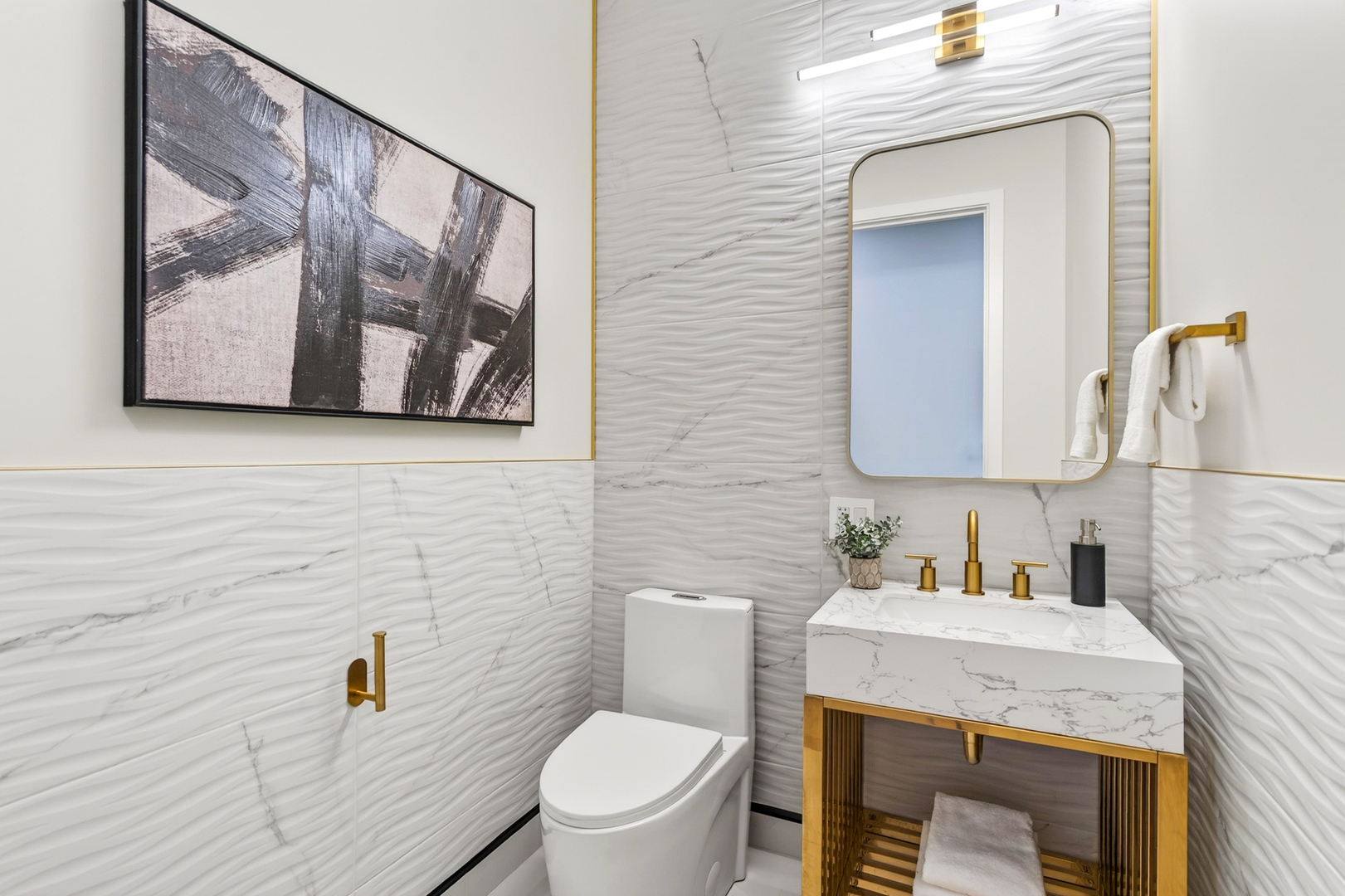 2024 West Irving Park Road, Unit 302 Chicago, IL 60618 - Photo 25 of 32 a bathroom with a toilet a sink and mirror