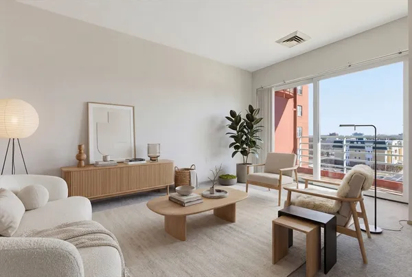 a living room with furniture and a large window