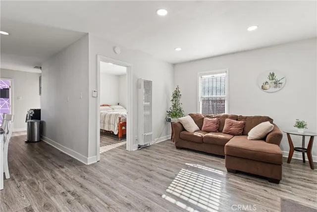 a bedroom with a bed and a television