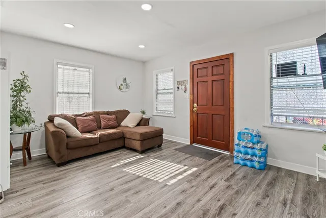 a kitchen with appliances a sink and a window