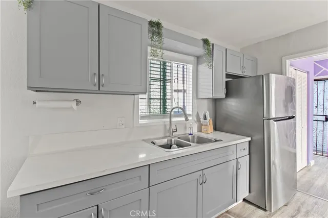 a kitchen with stainless steel appliances granite countertop a stove and a microwave