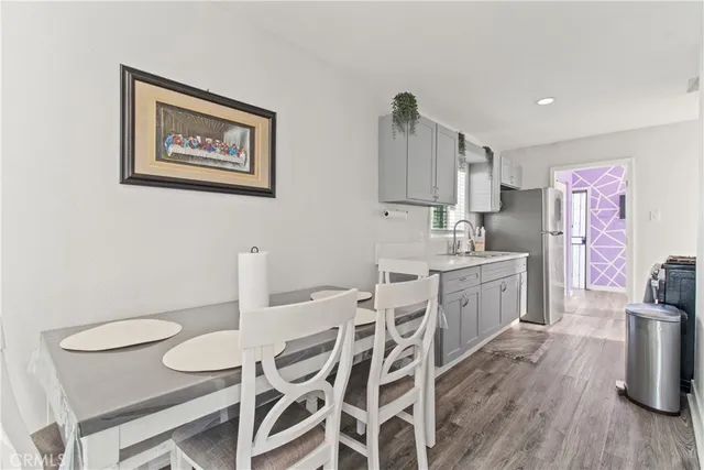 a view of a livingroom with wooden floor and closet