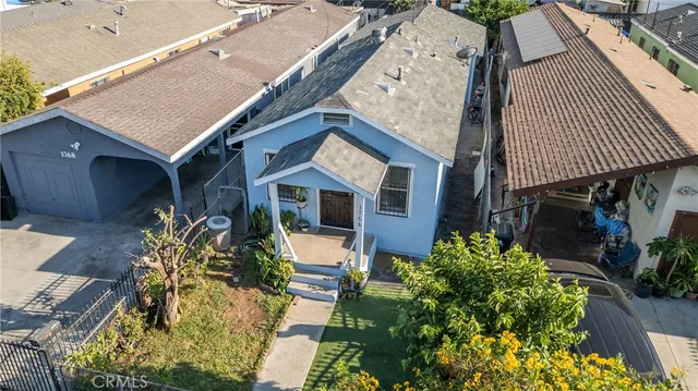 an aerial view of a house with swimming pool patio and glass door