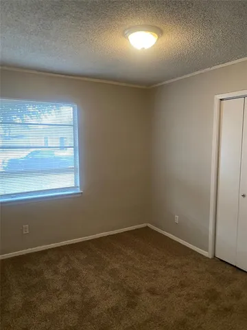 an empty room with a empty space and windows