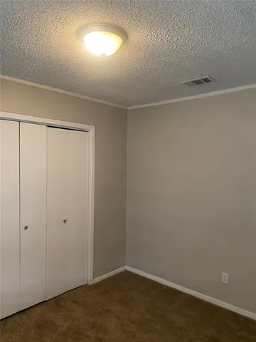 an empty room with a empty space and window