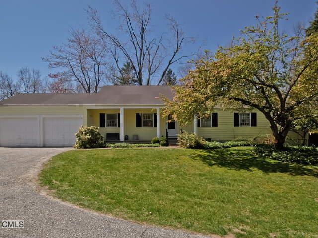 56 Hickory Hill Road Wilton, CT 06897 - Photo 1 of 1 a front view of a house with a garden