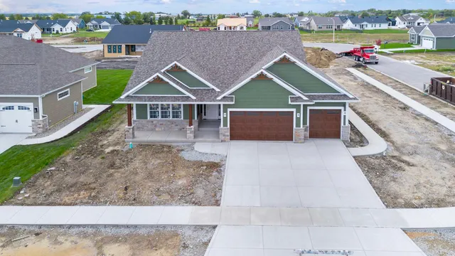 an aerial view of a house with yard
