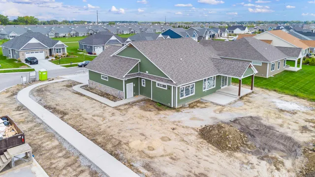 an aerial view of a house with a yard
