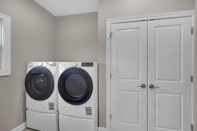 a large kitchen with stainless steel appliances a large counter top oven a sink and a refrigerator