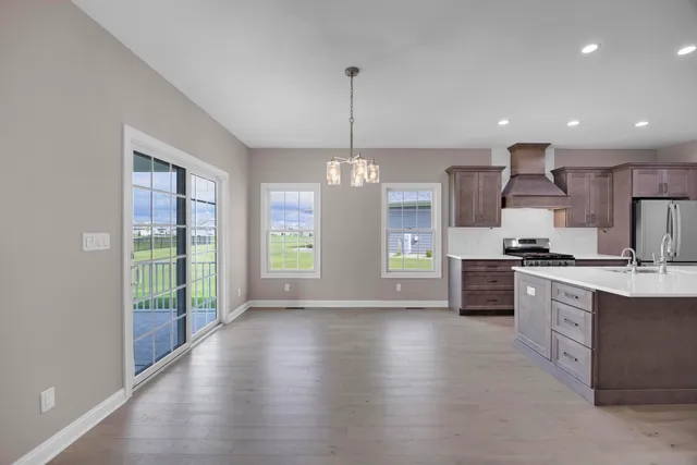 a view of hallway with wooden floor