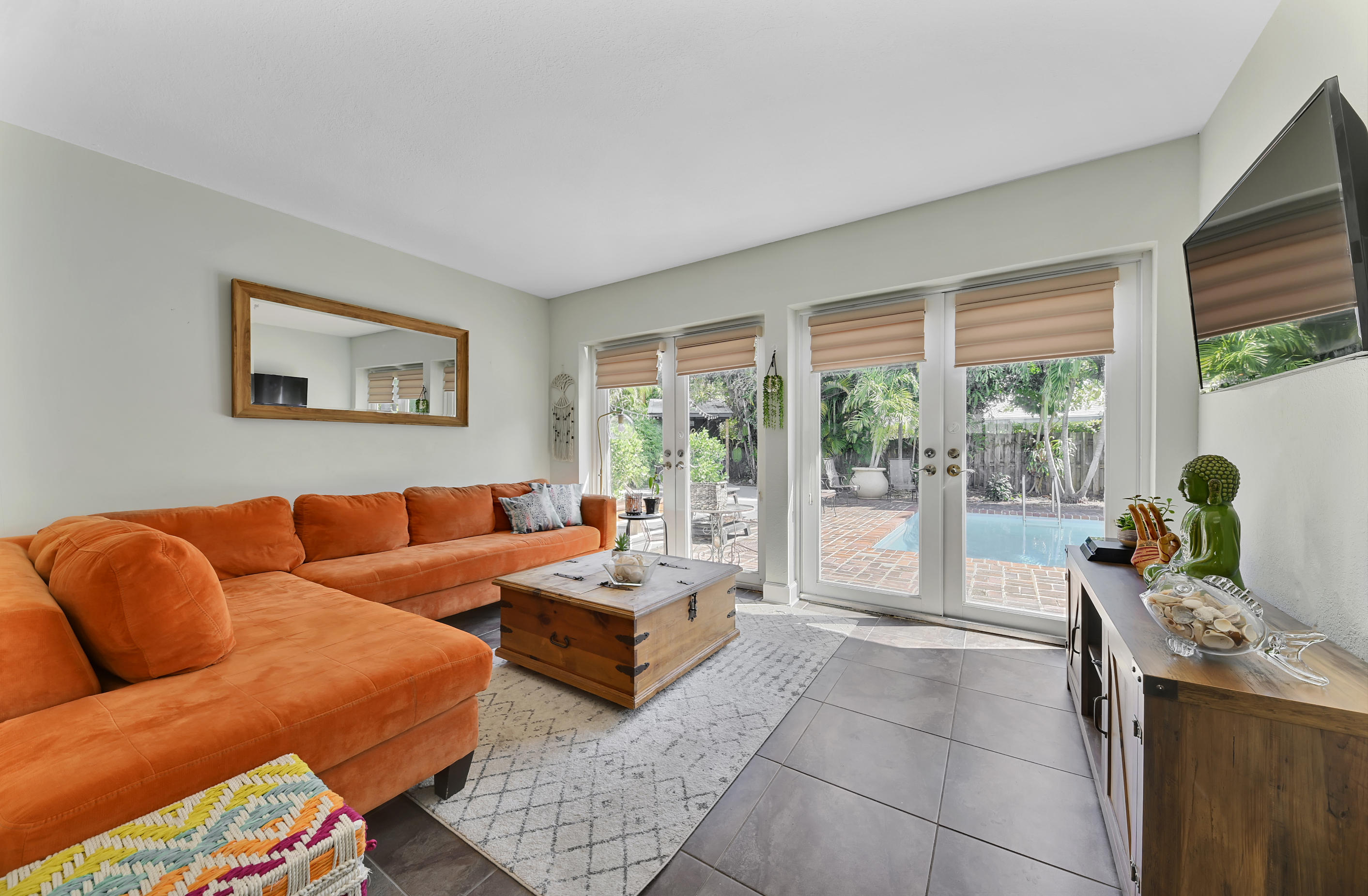 242 Northwest 12th Avenue Boca Raton, FL 33486 - Photo 5 of 13 a living room with furniture and large windows